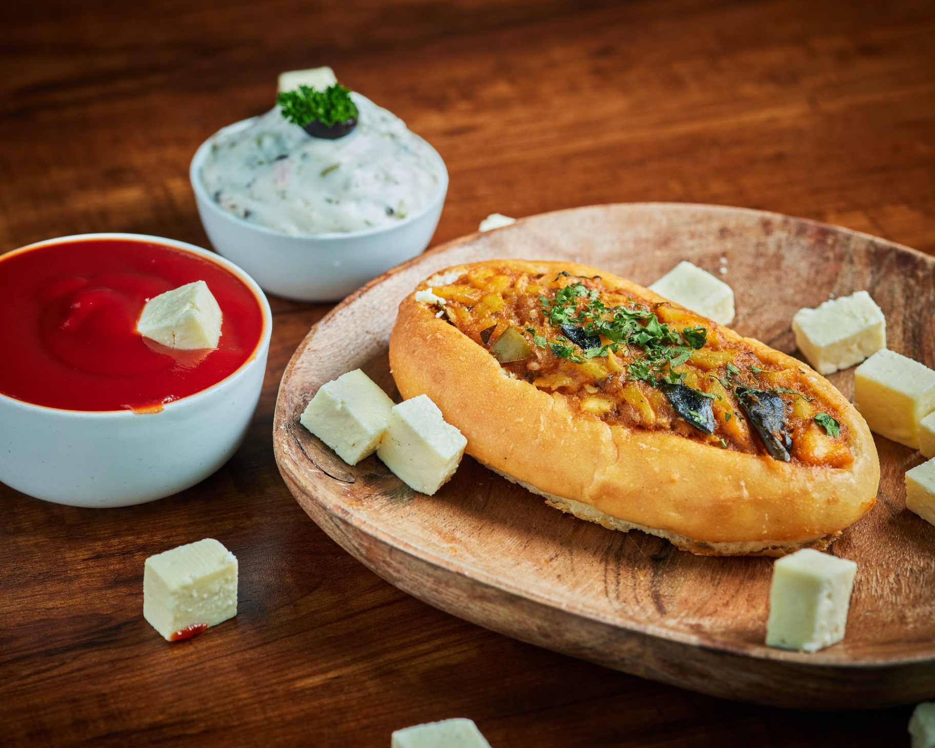 Paneer-stuffed bread with dips